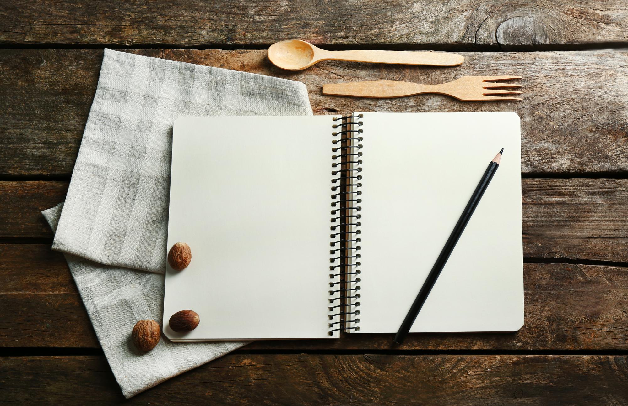 Notebooks and tasting notes on table